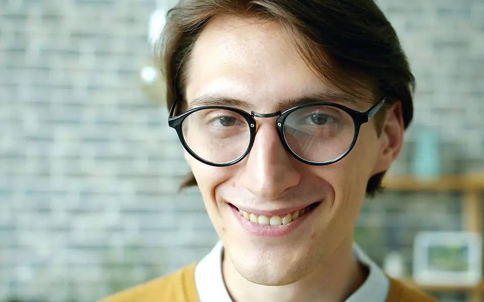 Patient smiling while wearing clear aligners