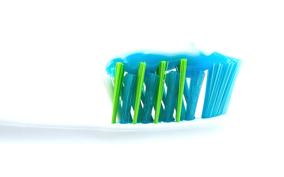 Toothbrush and whitening products on a clean surface